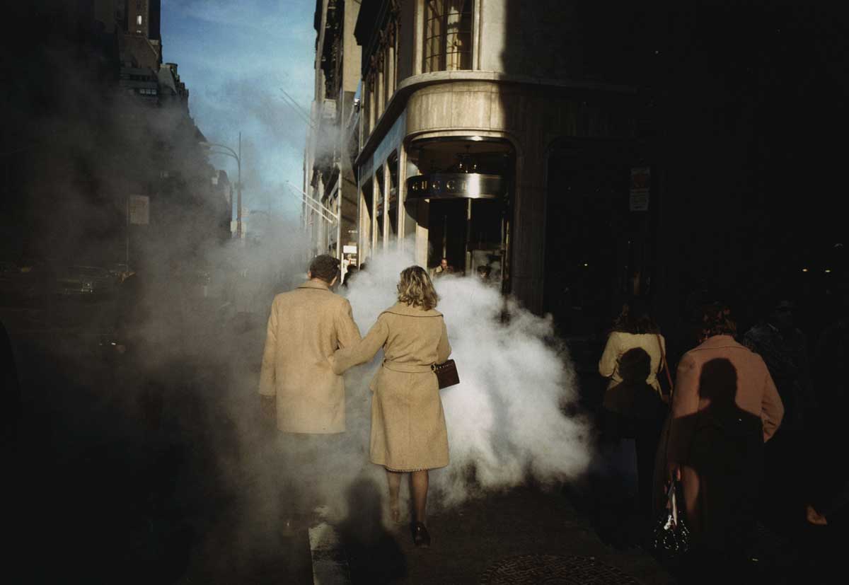 Joel Meyerowitz Camel Coat Couple in Street Steam, New York City, 1975.
