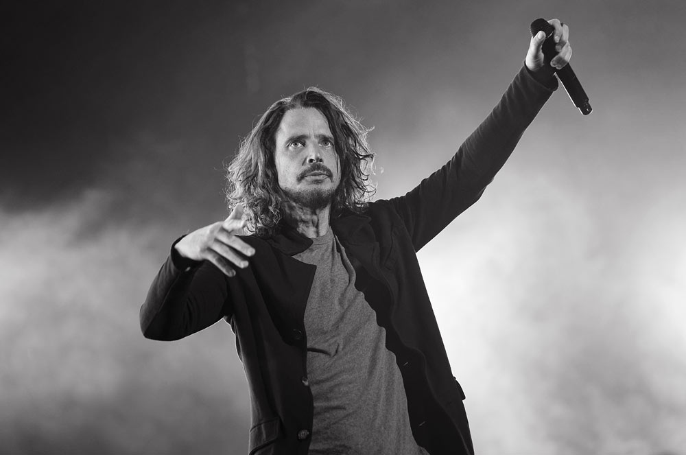 Chris Cornell of Soundgarden in 2017. Final performance. 
 "This photo always brings about a great deal of emotion in me. 
 I did this image of Chris during his very last performance onstage at Detroit's Fox Theater on May 17, 2017.  A few hours later, he would tragically take his own life. What I remember most about this show, is the sheer joy that Chris showed during the first few songs.  He seemed incredibly happy..fist bumping fans in the front row and throwing his arm around Kim Thayil as he soloed. In 27 years of photographing Soundgarden, I had never gotten a photo of Chris and Kim interacting like that before, just sharing the joy of making music together.  Of course, now when I view the images, I find myself searching Chris' eyes, wondering if there was something that could have given us a clue as to what he was going through."
Copyrights to Ken Settle © All rights reserved.