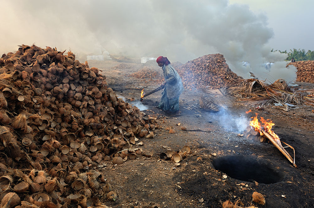 A worker lights up the pit
Copyrights to Debasish Ghosh © All Rights Reserved.