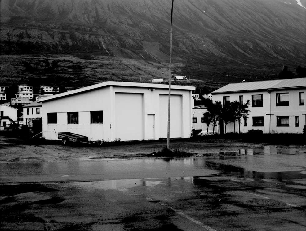 Like many Icelandic towns, Ólafsfjörður sits under the shadows of steep mountains, beautiful in the sun, looming over them in the summer rain. Scott Probst © All rights reserved.