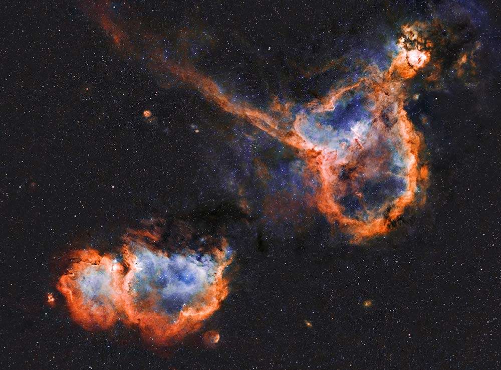 This is a photo of The Heart (IC 1805) and Soul (IC 1848) nebulae, 7500 light-years away from Earth, in the constellation of Cassiopeia. They form  a vast star-forming complex that makes up part of the Perseus spiral arm of our Milky Way galaxy. This photo is over  8 hours of exposure time.  I took this photo in Norfolk, England.
Kasra Karimi © All rights reserved.