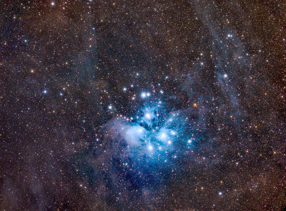 The Pleiades or Messier 45 (also known as Seven Sisters) is a reflection nebula in the constellation of Taurus and 444 light-years away from us. If you get away from the city's light pollution, you will be able to see it with the naked eye in summer. I took this photo in West Sussex, England.
Kasra Karimi © All rights reserved.