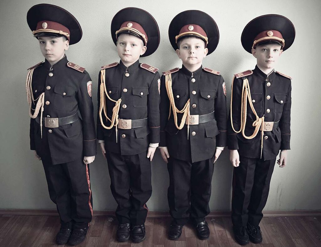 Young boys barely 6 or 7 years old posing in uniform in a military boarding school. Since the start of the conflict, military schools have been full, and parents send increasingly younger children there, Kyiv, January 2018.
Aude Osnowycz © All rights reserved.