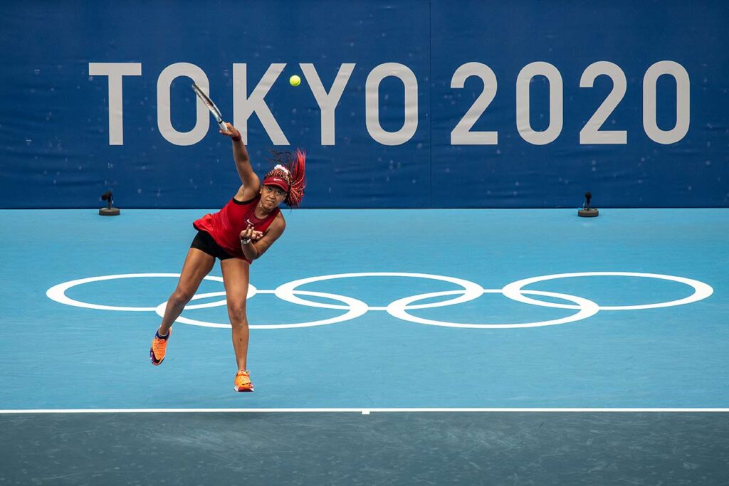 Naomi Osaka's powerful serves helped her defeat Switzerland's Viktorija Golubic in straight sets 6-3, 6-2 during her second-round match at the Tokyo Olympics on July 26. I used a Nikon D850 with a Nikkor 300mm f/4 set to 1/2500th of a second, f/5.6, ISO 800 to freeze the action. Mark Edward Harris © All rights reserved.