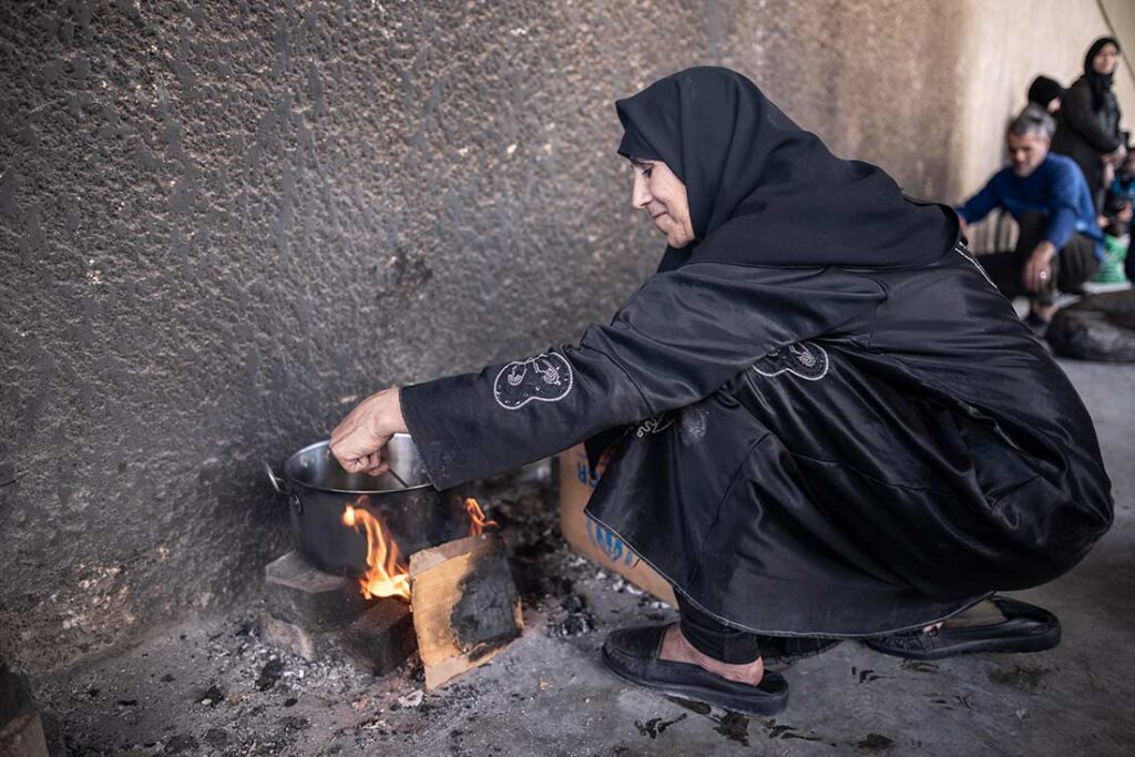 A woman cooking in the refugee camp of the people who fled from Eastern Ghouta Syria – rural of Damascus after the war; 
I took this photo with NRC in April 21,2018. 