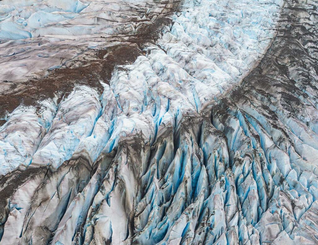 Glacier crevasses pose significant dangers to anyone working in glacier-covered areas. They typically undergo rigorous training in glacier safety, use specialized equipment, and follow established safety protocols.
Erin Towns © All rights reserved.