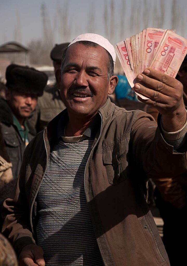 Livestock Profit
The Uyghurs travel many hours to trade at the Sunday market, but some days yield greater profits than others and greater satisfaction.