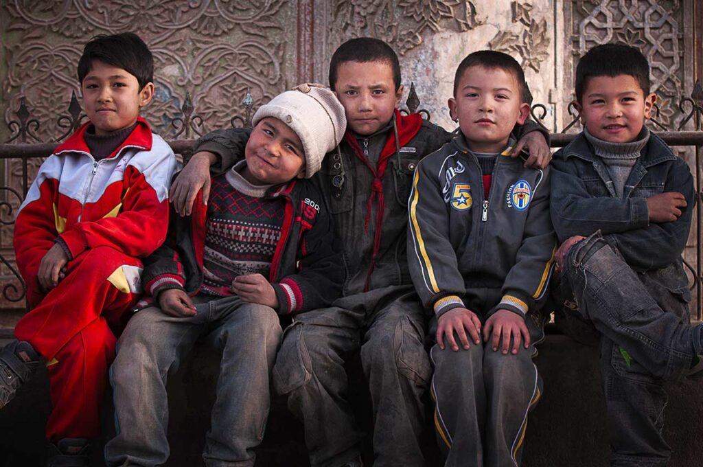 Untitled
After being led through a labyrinth of back alleyways by a group of girls who wanted their picture taken, these Uyghur boys scrambled together into a moment for their own group portrait.