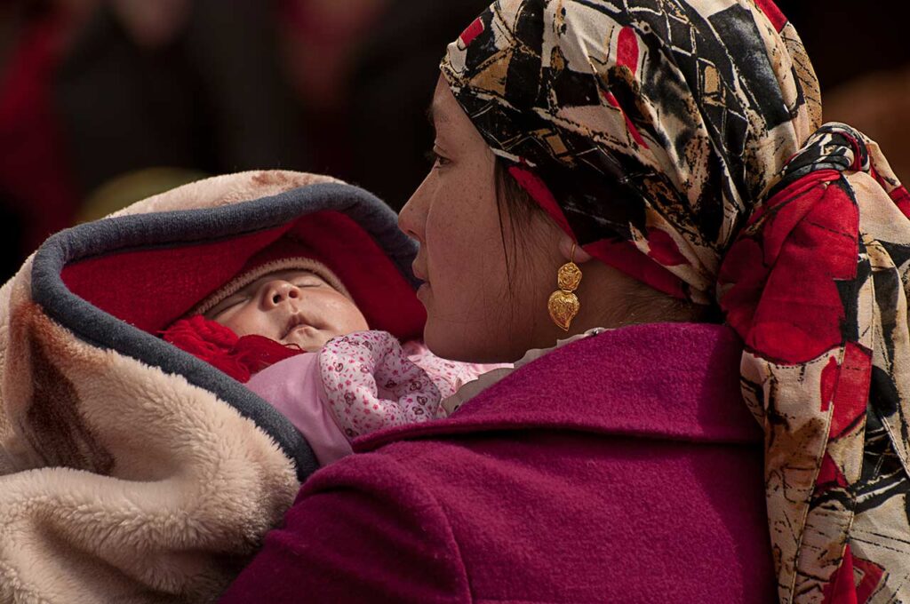 Mother and Child
A Uyghur mother and her newborn visiting the Kashgar open market.