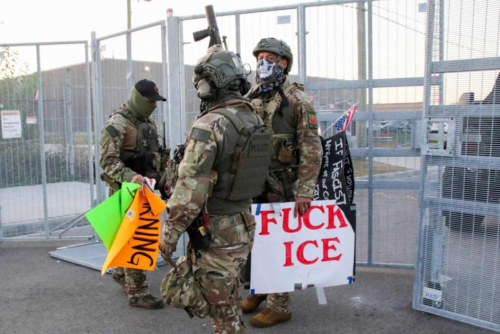 Broadview’s Stand #1
A few armed Federal agents remove the posters put up on the front of the fencing surrounding the front entrance of the ICE detention facility on Beach Street in Broadview, IL, USA. Since the start of September, protesters have returned to this facility to attempt to block operations tied to enforcement sweeps.
Alexandra Buxbaum © All rights reserved.