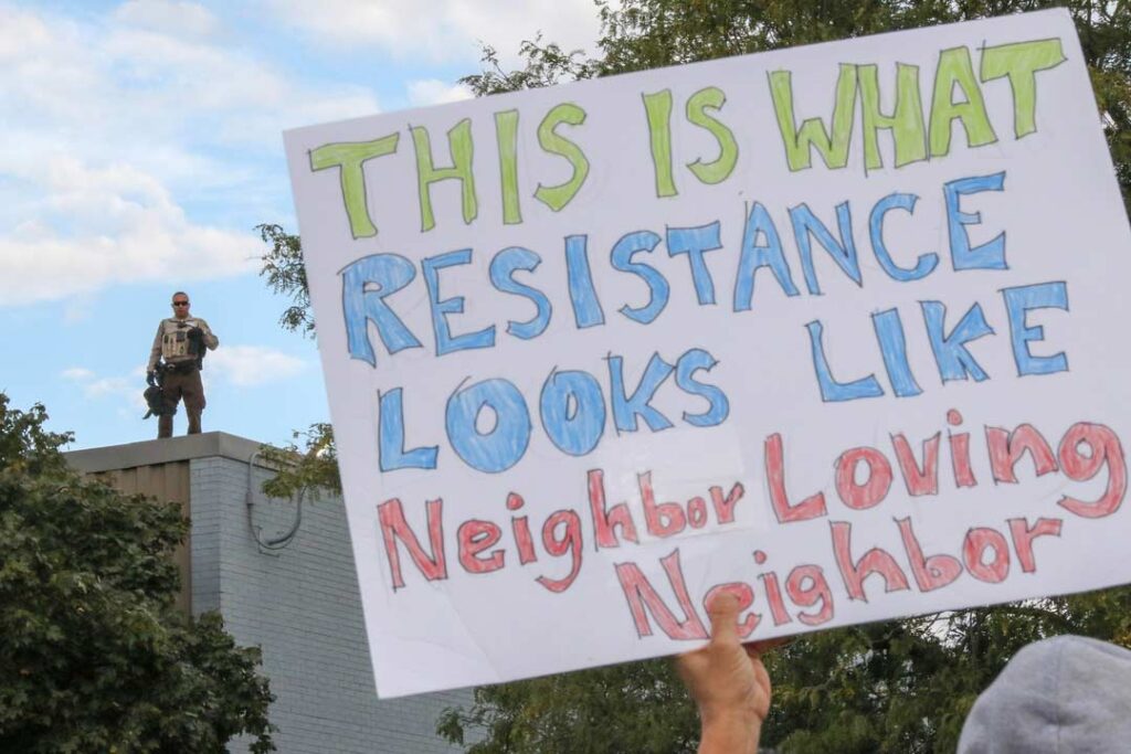 Broadview’s Stand #13
Protesters continue to demonstrate on Fridays outside the ICE Detention Center at 25th Street and Harvard in Broadview, IL, USA. Broadview Mayor Katrina Thompson set hours of protest from 9 AM to 6PM and within designated protest zones behind concrete barriers.
Alexandra Buxbaum © All rights reserved.