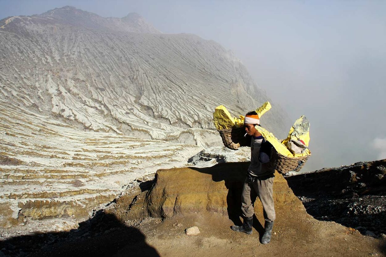 Sulfur Carrier
A lone figure carries sulfur along the slopes of Kawah Ijen, the volcano's weight heavy on his shoulders. (Java, Indonesia)

Gianni Alessi © 
All rights reserved.